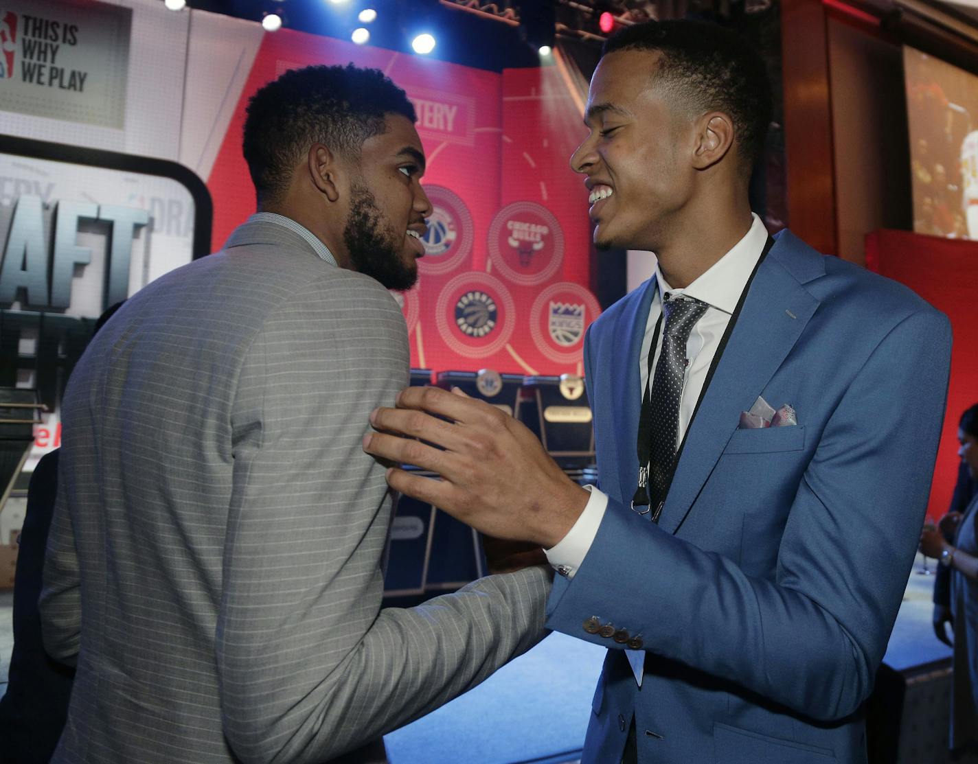 Minnesota Timberwolves center, Karl-Anthony Towns, left, greets draft prospect Skal Labissiere before the start of the NBA basketball draft lottery, Tuesday, May 17, 2016, in New York. (AP Photo/Julie Jacobson)