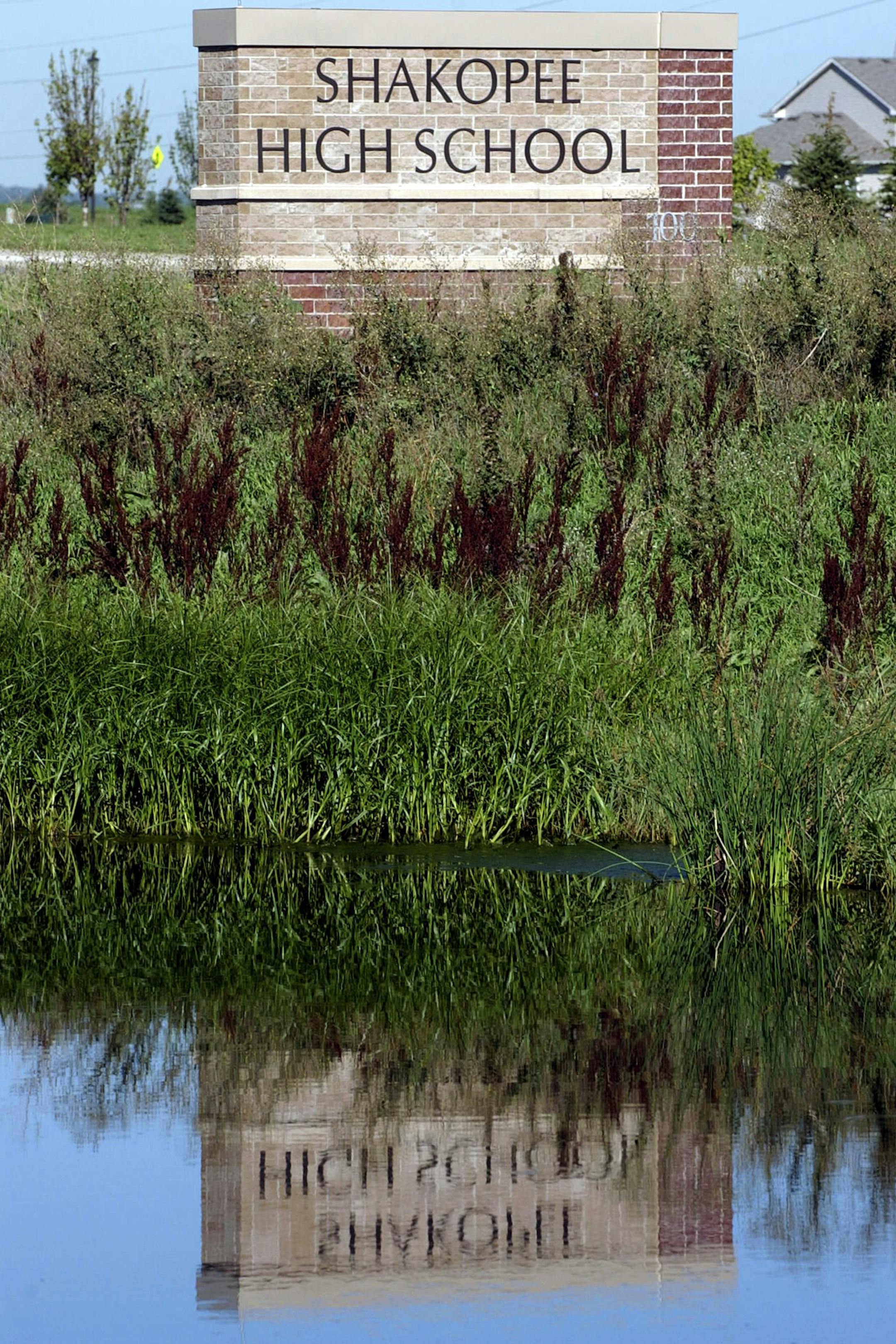 JOEY MCLEISTER ¬• jmcleister@startribune.com Shakopee,Mn.,Thurs.,Aug. 30, 2007--The sign for the new Shakopee High School reflected in a pond. GENERAL INFORMATION: The new Shakopee High School opens Sept. 5. ORG XMIT: MIN2013040418142830