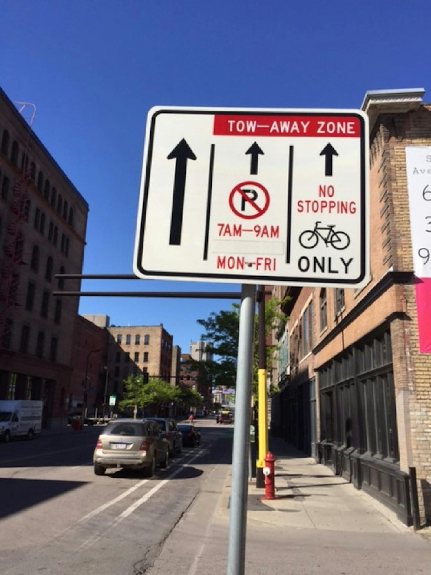 A confusing traffic sign at a location where bicycles, drivers and parkers must perplexingly joust in Minneapolis.