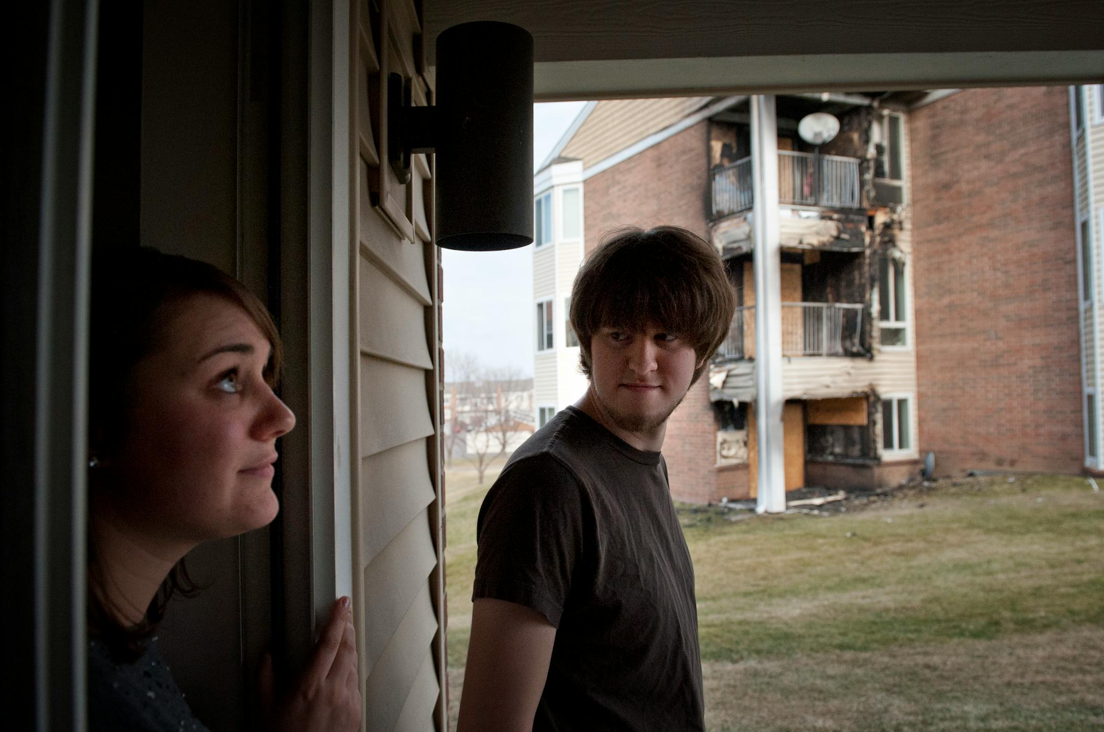 Emma Ziebarth and Mitch Ogaard live next door to the scene of the fire. Residents of Cinnamon Ridge Apartments in Eagan awoke to a 3:30 am fire, Thursday, November 22, 2012. 24 units were evacuated and residents of 6 units were displaced.