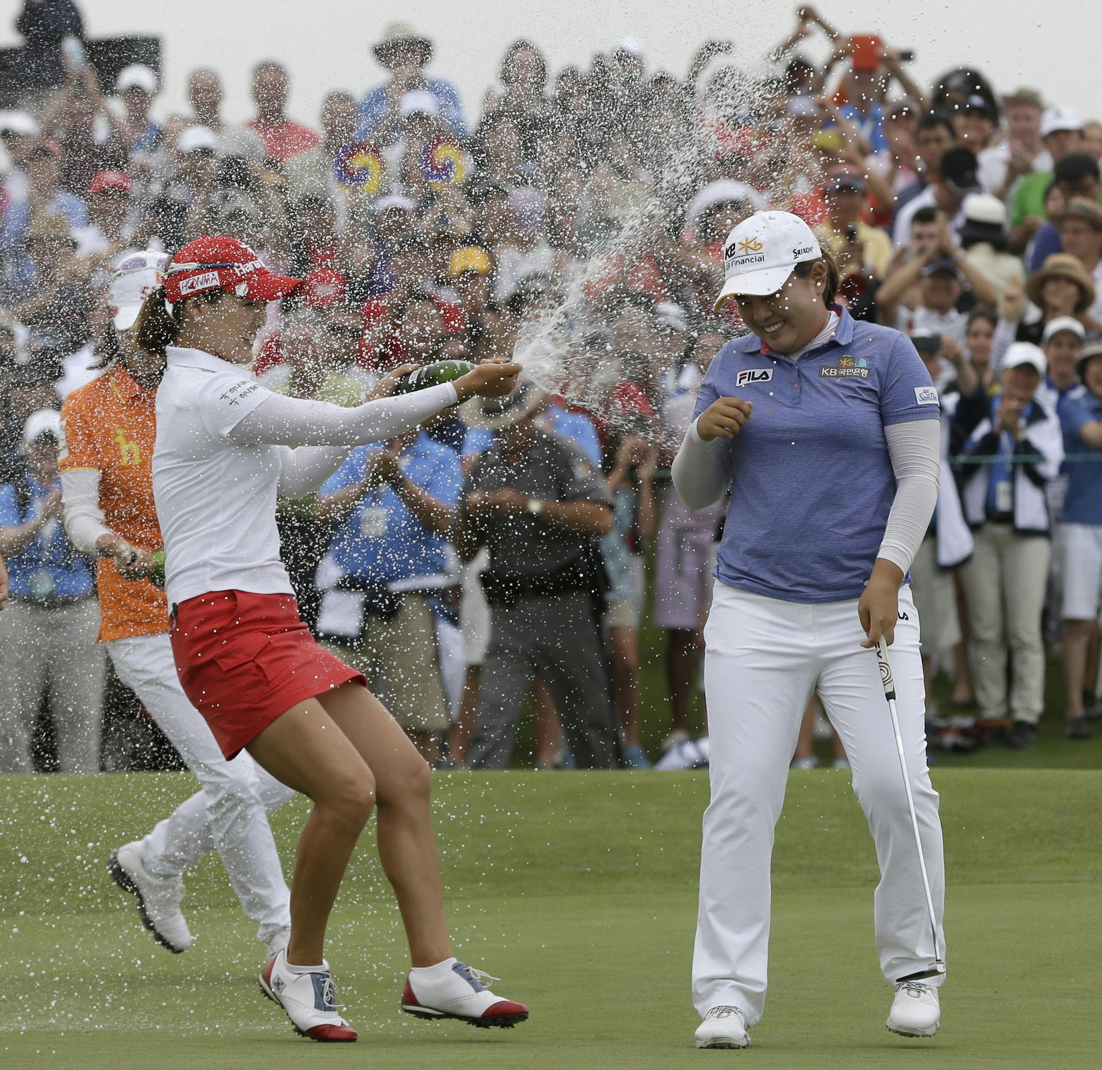 Inbee Park of South Korea was sprayed with champagne after sinking her last putt on the 18th green during the final round at the U.S. Women's Open golf tournament at Sebonack Golf Club in Southampton, N.Y., on Sunday.