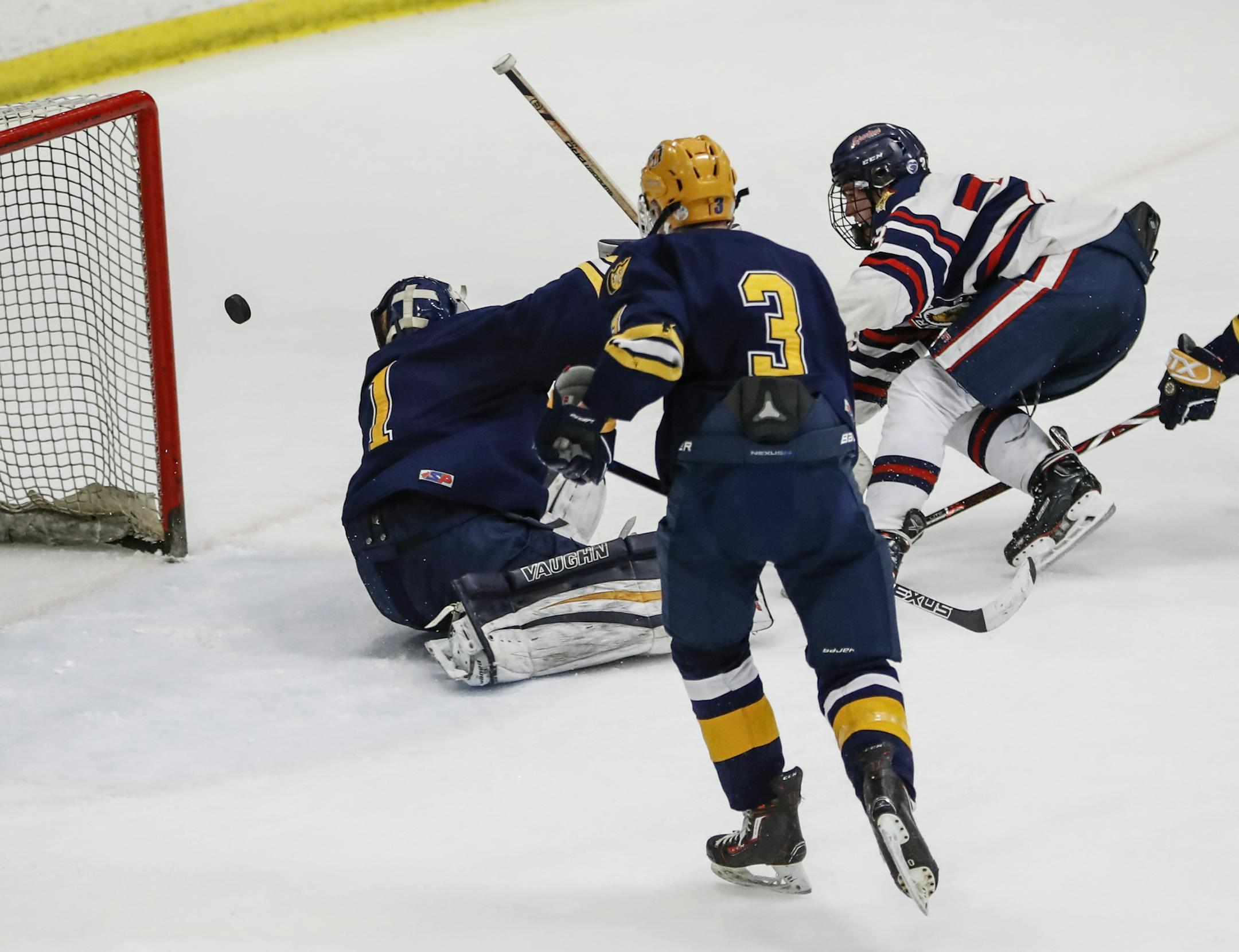 Orono forward Thomas Walker (23) scored the winning goal in overtime on Breck School goalie Blaine (1) in the 2A section championship in Minneapolis on Thursday, March 1, 2018. ] RENEE JONES SCHNEIDER &#x2022; renee.jones@startribune.com