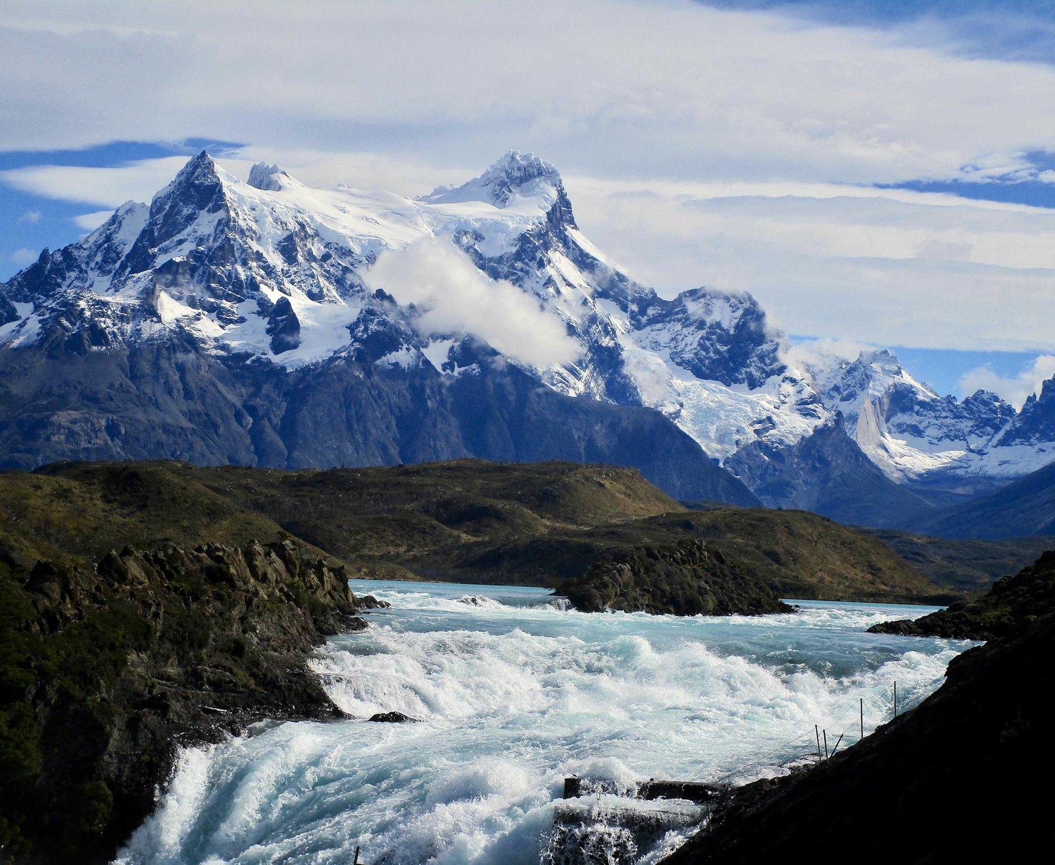 I took the photo in Patagonia, Chile, in mid-March of this year with a Canon EOS Rebel and an 18-135 lens. It was taken on a short hike from our hotel (Explora Lodge) which is one of very few that are actually within the Torres Des Paine National Park. It was taken at the outflow of the lake at the base of what is known as the Massiv, perhaps the most iconic of mountains in Patagonia. It was exciting for me as it was on the final day of our stay and we had battled rain and clouds the previous th