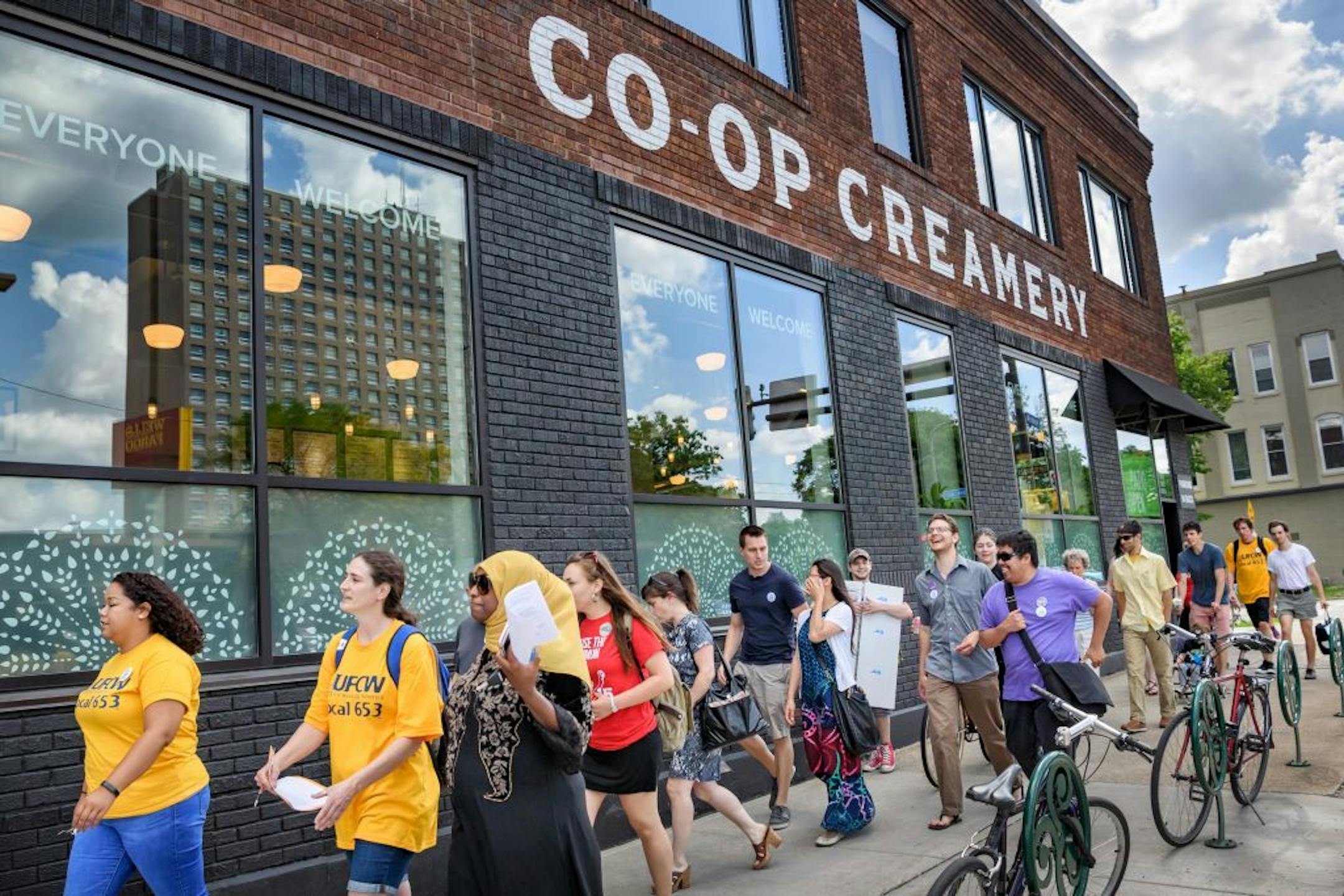 Seward Co-op workers and allies walked past the Co-op Creamery to Seward Co-op offices in 2017, shortly after they voted to unionize.