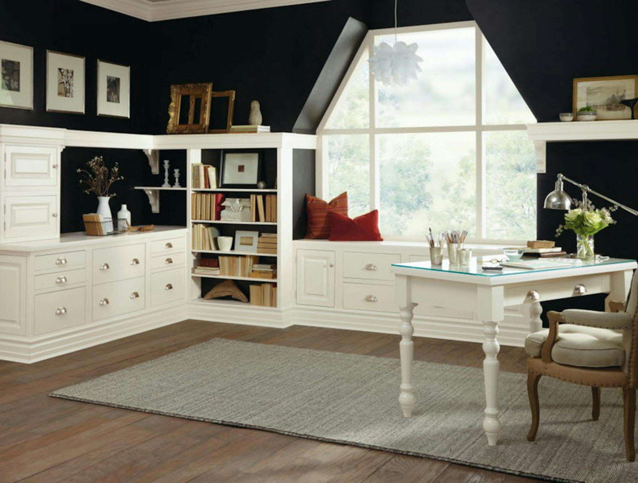 Artwork, absence of clutter, a view and dramatic black walls make this home office a pleasant place to work.
