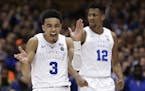 Duke's Tre Jones (3) and Javin DeLaurier (12) react following a play against Wake Forest during the second half of an NCAA college basketball game in 