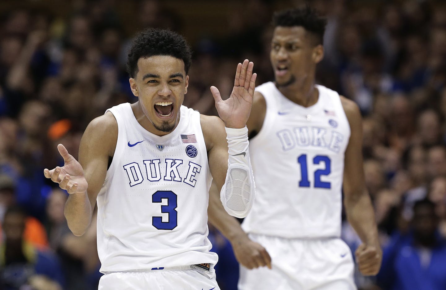 Duke's Tre Jones (3) and Javin DeLaurier (12) react following a play against Wake Forest during the second half of an NCAA college basketball game in Durham, N.C., Tuesday, March 5, 2019. Duke won 71-70. (AP Photo/Gerry Broome)