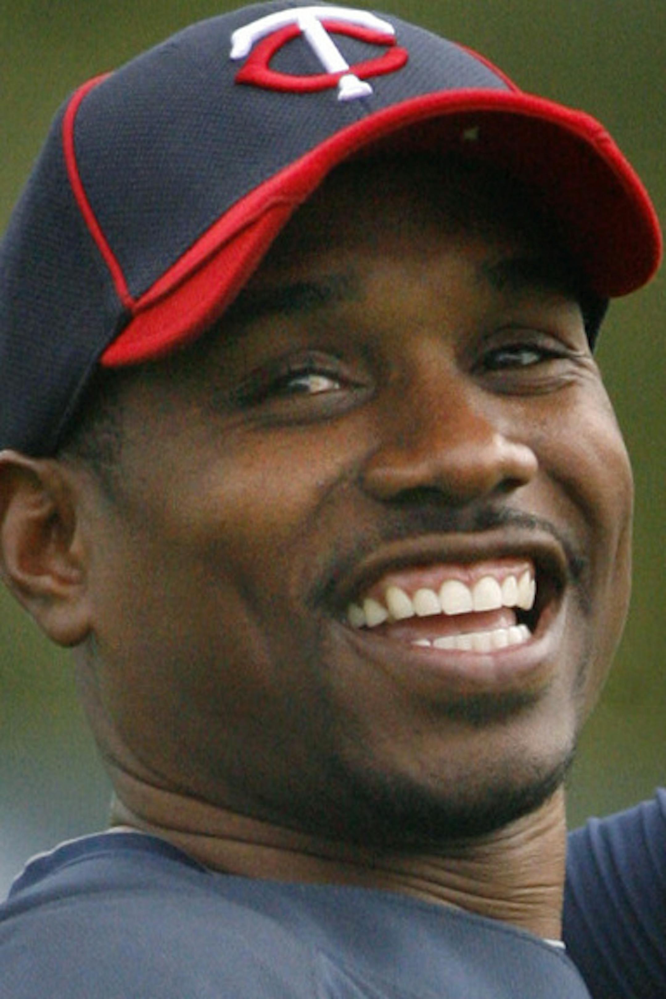 ELIZABETH FLORES • eflores@startribune.com February 27, 2010 -Fort Myers, FL IN THIS PHOTO: ] Minnesota Twins Jacque Jones warmed up with other outfielders during practice at Spring Training at Hammond Stadium. Saturday was the first day of practice with the entire team.