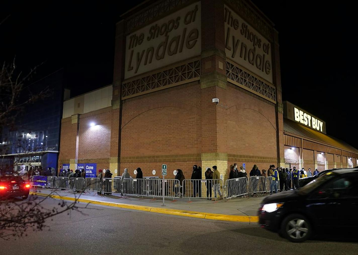 A line of Black Friday shoppers snakes around a corner outside Best Buy for the electronics retailer's early 5 a.m. opening Friday in Richfield.