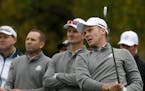 Europe's Danny Willett watches his drive with teammate Justin Rose and Sergio Garcia during a practice round for the Ryder Cup Wednesday.