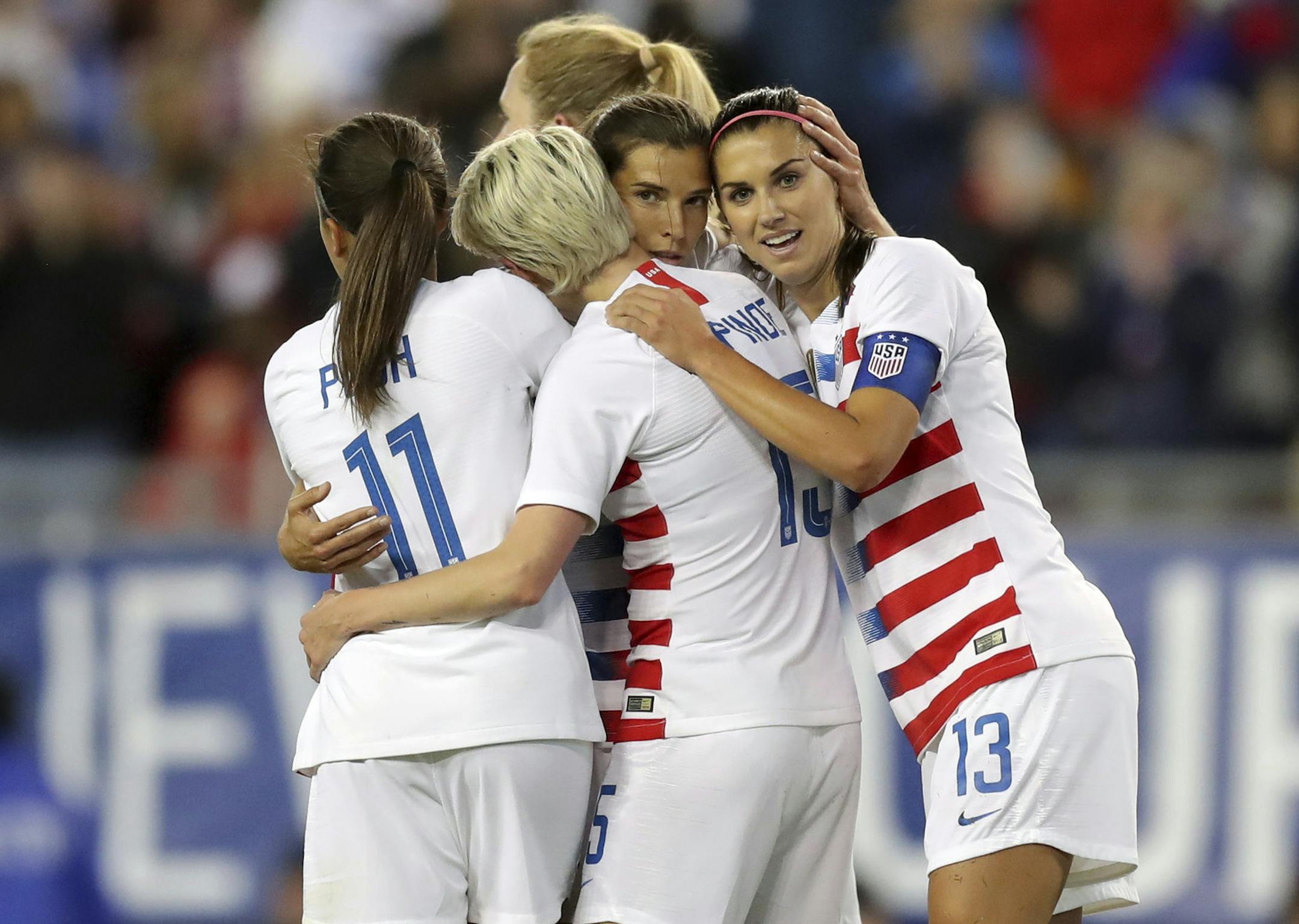 The United States' Tobin Heath, second from right, is congratulated on her goal by Mallory Pugh (11), Megan Rapinoe and Alex Morgan (13) during the first half of a SheBelieves Cup soccer match against Brazil in Tampa, Fla., on March 5. The U.S. women's nationalteam's discrimination lawsuit against the U.S. Soccer Federation highlights the struggle for female athletes globally to achieve fair compensation for their efforts, even if that doesn't mean identical paychecks to their male counterparts.