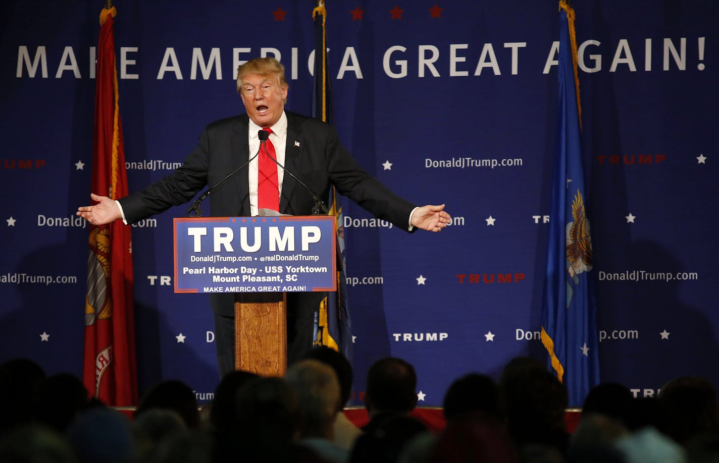 Republican presidential candidate, businessman Donald Trump, speaks during a rally coinciding with Pearl Harbor Day at Patriots Point aboard the aircraft carrier USS Yorktown in Mt. Pleasant, S.C., Monday, Dec. 7, 2015. Trump defended his plan, Tuesday, Dec. 8, 2015, for a "total and complete shutdown of Muslims entering the United States" by comparing it with President Franklin Roosevelt's decision to inter Japanese Americans during World War II. (AP Photo/Mic Smith) ORG XMIT: MIN20151208174943