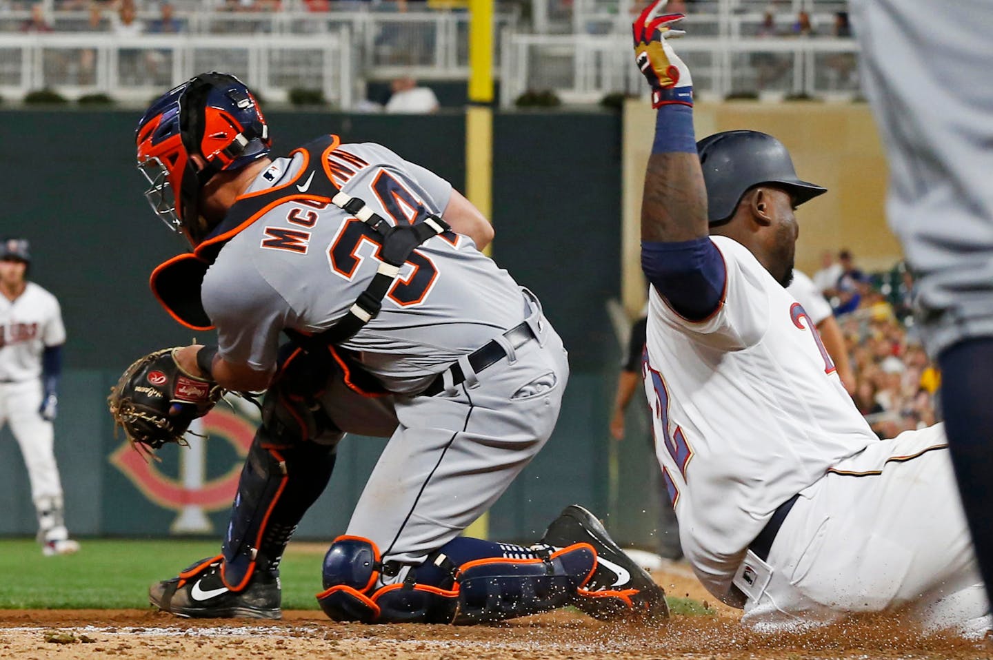 The Twins' Miguel Sano beat the throw to Tigers catcher James McCann to score on a two-run single by Mitch Garver in the sixth inning of the Twins' 15-8 victory Thursday.