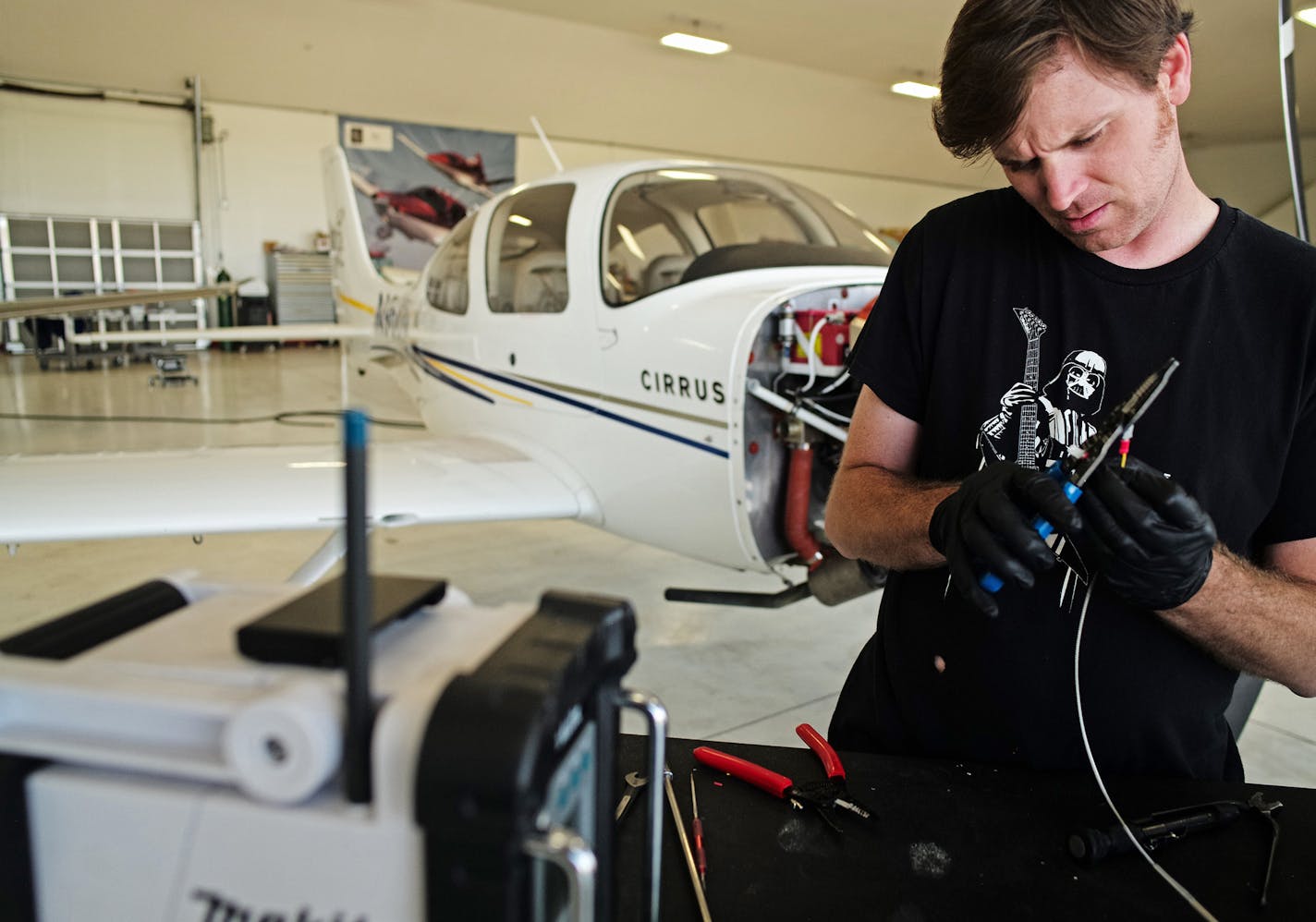 Twin Cities Aviation mechanic Will Gray fixed a Cirrus flight trainer. The flight training school has also seen good times from a better economy with more people taking lessons.