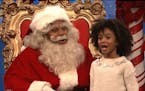 In an image taken from video, a mall Santa played by Kenan Thompson faced tough questions from kids about prominent men accused of sexual misconduct.