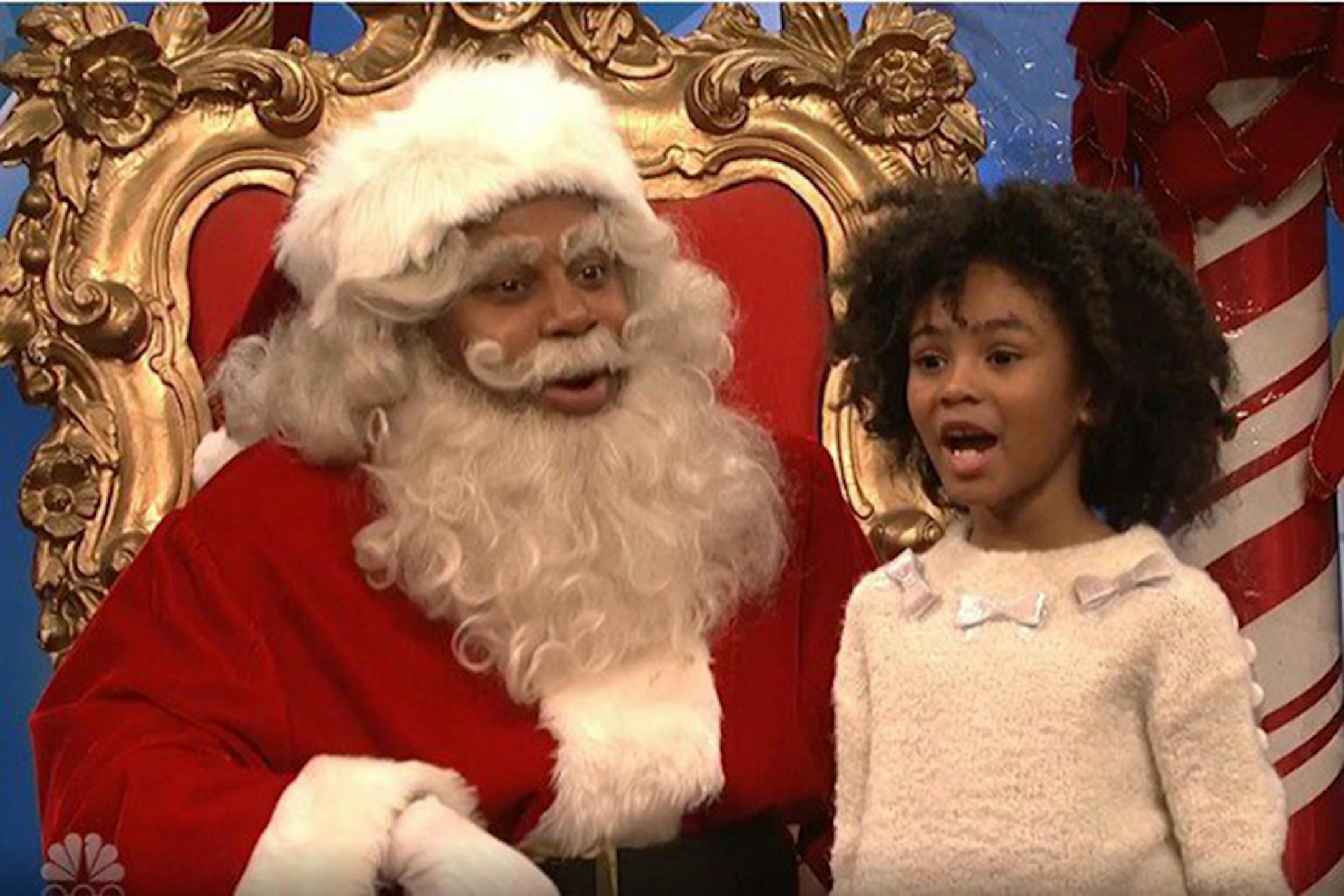 In an image taken from video, a mall Santa played by Kenan Thompson faced tough questions from kids about prominent men accused of sexual misconduct.
