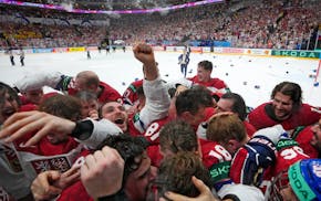 Members of the Czech Republic team celebrates after they defeated Switzerland 2-0 in a gold medal match at the world championships in Prague.