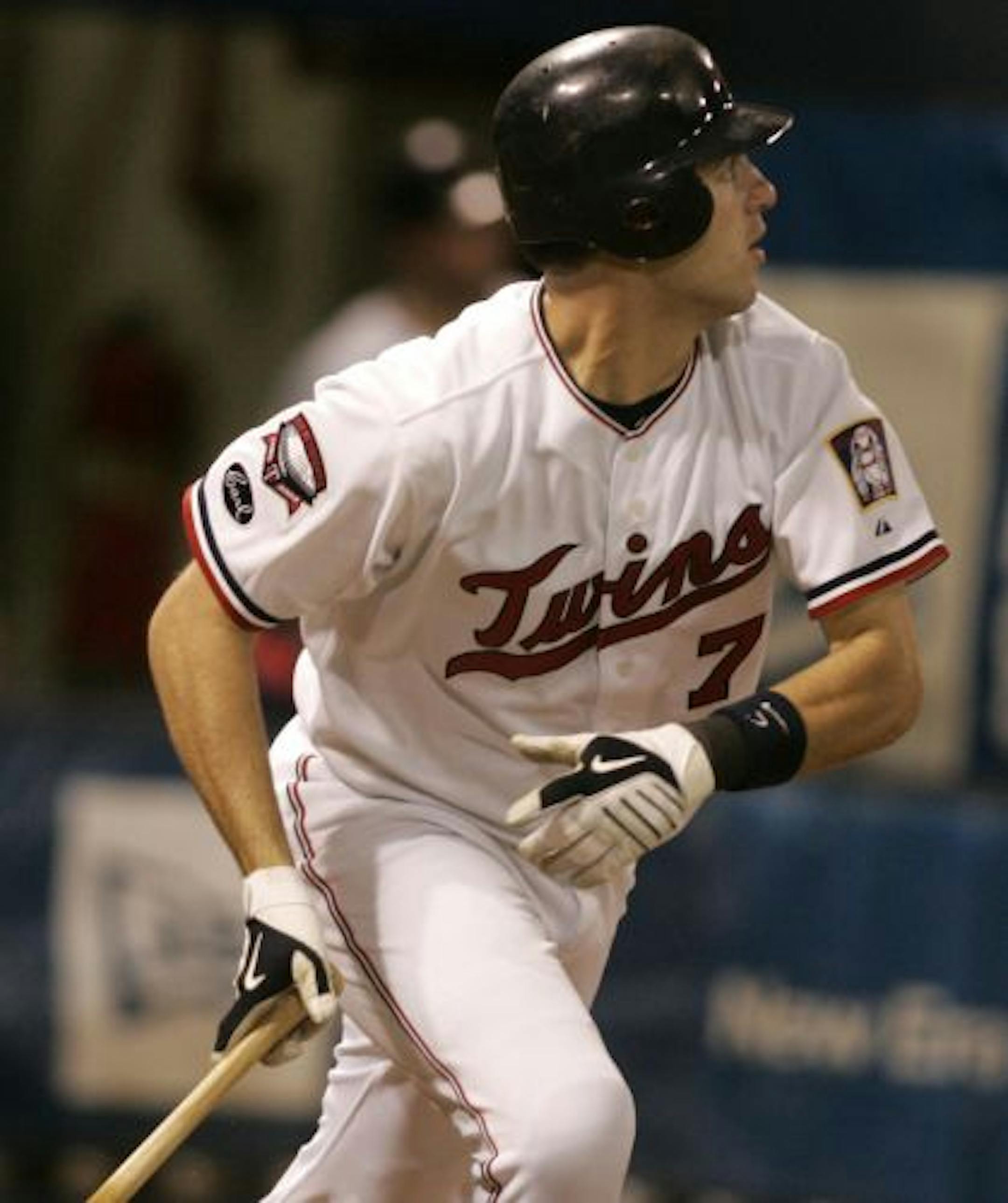 Minnesota Twins catcher Joe Mauer follows through on his 5th inning opposite field solo homerun against the Milwaukee Brewers at the Metrodome.