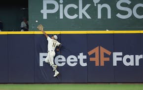 Brewers center fielder Jackson Chourio makes a leaping catch to rob the Twins' Royce Lewis of a tying two-run homer Sunday in Milwaukee.