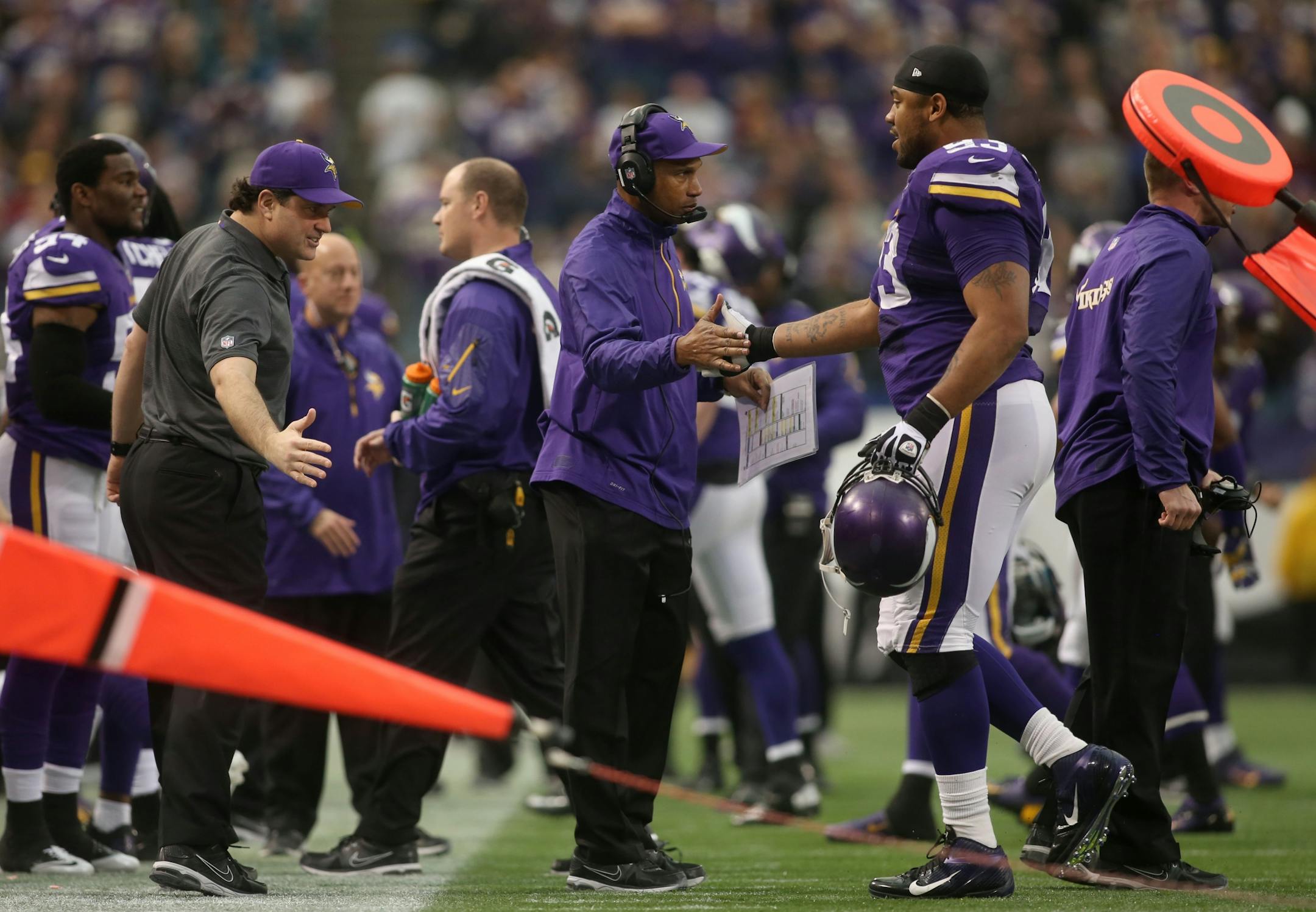 Head coach Leslie Frazier congratulated defensive tackle Kevin Williams (93) after the Vikings defense stopped the Eagles on 4th and 1 in the third quarter on the Eagles' 24 yard line.