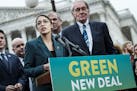 Rep. Alexandria Ocasio-Cortez (D-N.Y.) speaks alongside Sen. Ed Markey (D-Mass.) at a news conference about the Green New Deal, in Washington, Feb. 7,