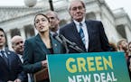 Rep. Alexandria Ocasio-Cortez (D-N.Y.) speaks alongside Sen. Ed Markey (D-Mass.) at a news conference about the Green New Deal, in Washington, Feb. 7,