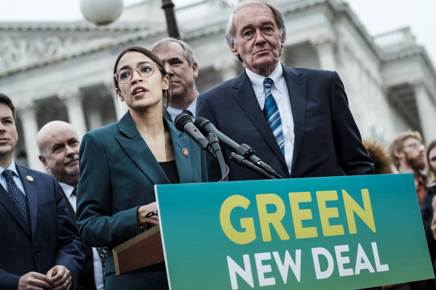 Rep. Alexandria Ocasio-Cortez (D-N.Y.) speaks alongside Sen. Ed Markey (D-Mass.) at a news conference about the Green New Deal, in Washington, Feb. 7, 2019. The measure, drafted by Ocasio-Cortez and Markey, calls for a sweeping environmental and economic mobilization that would make the United States carbon neutral by 2030. (Pete Marovich/The New York Times)