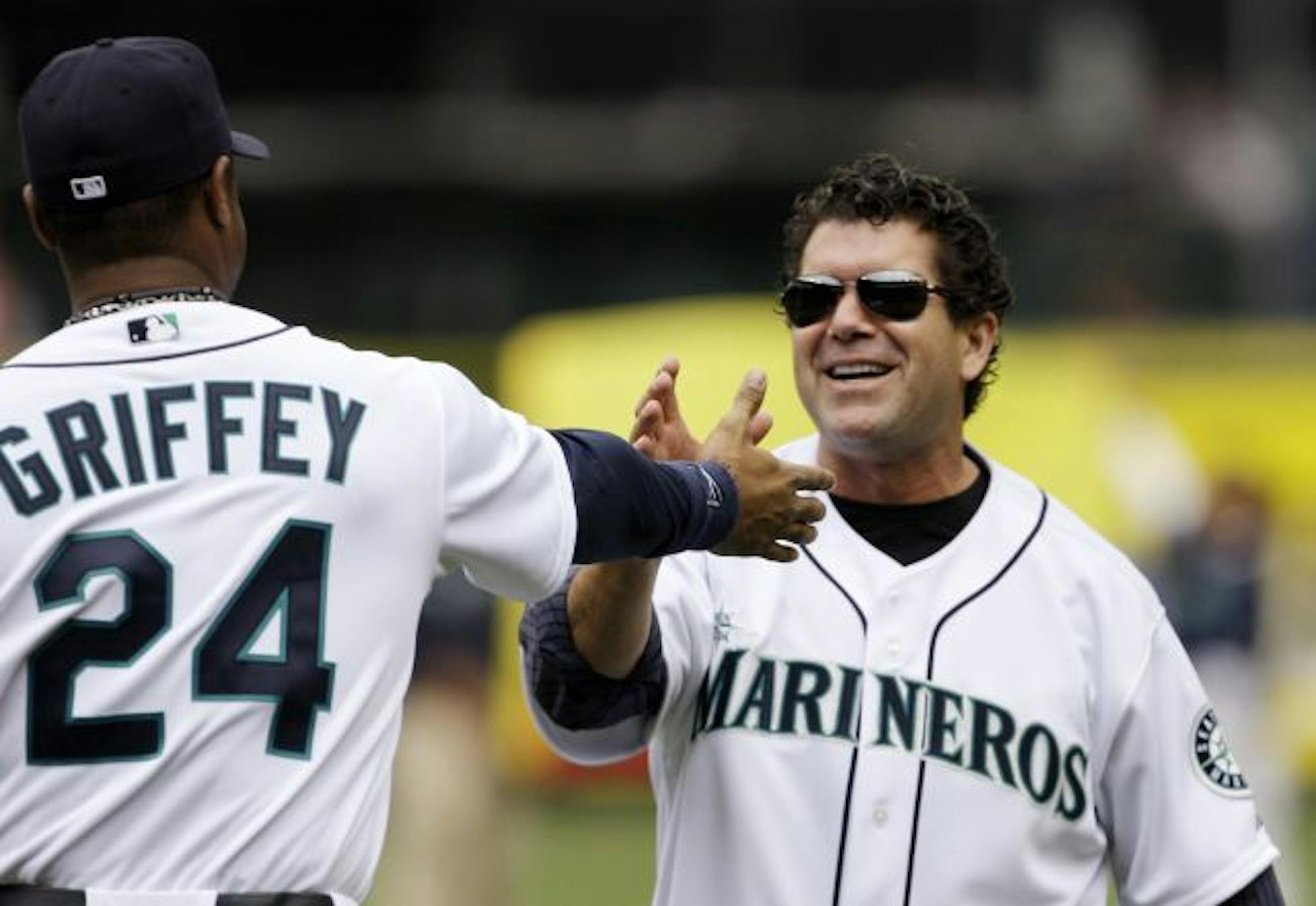 Former Seattle Mariners designated hitter Edgar Martinez, right, in 2009.