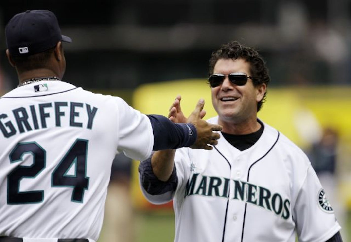 Former Seattle Mariners designated hitter Edgar Martinez, right, in 2009.