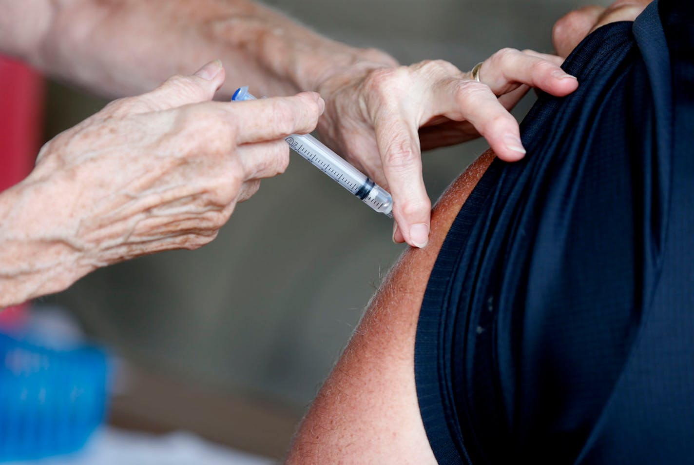 FILE - In this Tuesday, June 22, 2021, file photo, a man receives a COVID-19 vaccine at a clinic in Springfield, Mo. One Missouri hospital official is telling anyone making disparaging remarks about the COVID-19 vaccine to "Shut up" as state officials ask for federal help dealing with a surge in cases that has some counties urging new precautions. Deep vaccine resistance has allowed the delta variant, first identified India, to take hold in the state, straining hospitals, particularly in the Springfield area. (Nathan Papes/The Springfield News-Leader via AP, File)