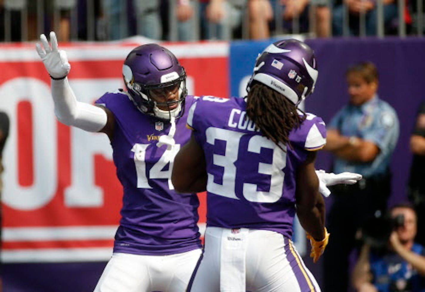 Minnesota Vikings wide receiver Stefon Diggs (14) celebrates with teammate Dalvin Cook (33) after catching a 22-yard touchdown pass during the first half of an NFL football game against the San Francisco 49ers, Sunday, Sept. 9, 2018, in Minneapolis. (AP Photo/Bruce Kluckhohn)