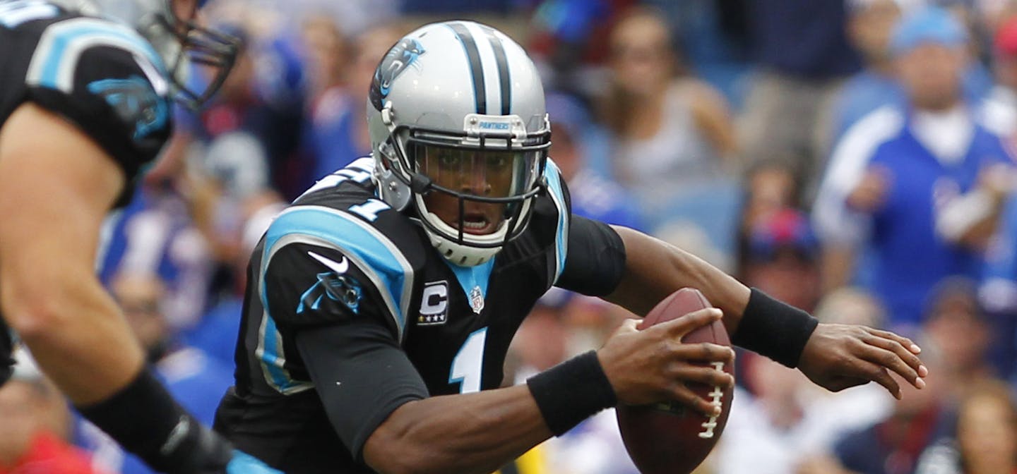 Carolina Panthers quarterback Cam Newton (1) scrambles against the Buffalo Bills in an NFL football game, Sunday, Sept. 15, 2013, in Orchard Park, N.Y. (AP Photo/Bill Wippert)