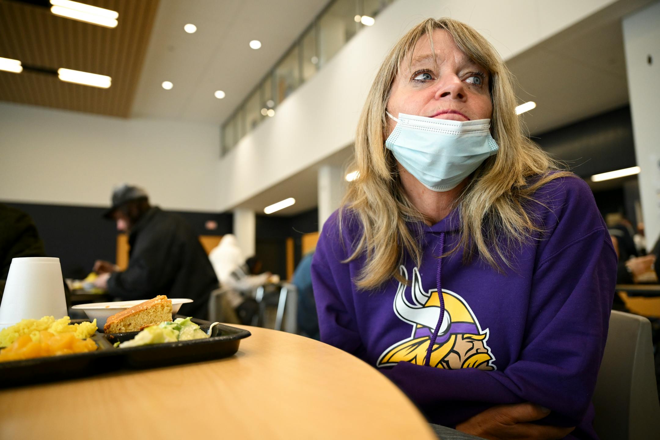 Gena Martinson, from Arlington-Green Isle, eats lunch at the Dorothy Day Opportunity Center. "Being in Minnesota and being raised in Minnesota, this (cold) is mild compared to back in the day in the 70's," said Martinson. "We're strong."