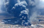 042718.N.DNT.REFINERYFIREc10 -- The Husky Energy refinery burns as seen in this aerial photo Thursday afternoon. Bob King / rking@duluthnews.com