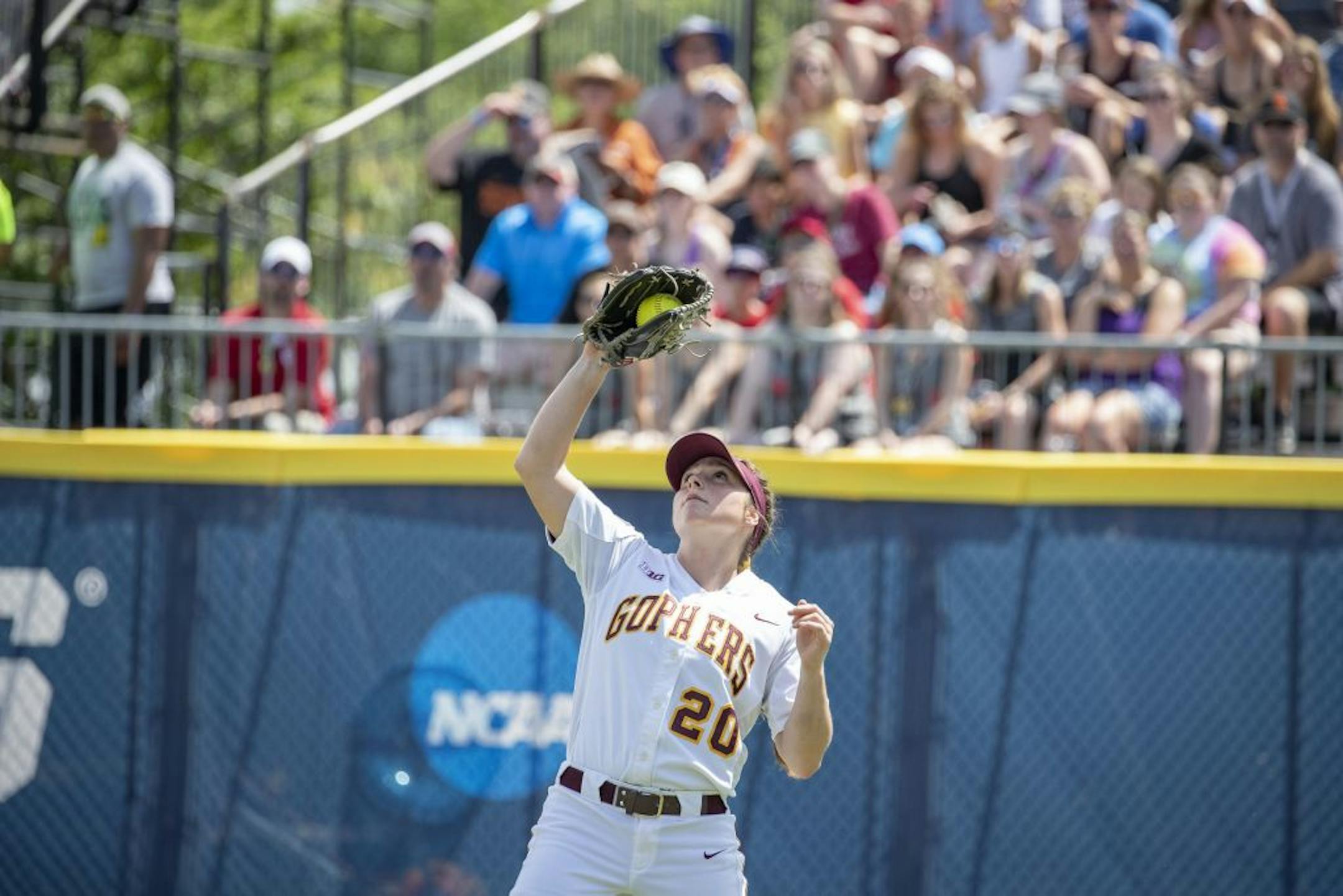 MinnesotaÕs Maddie Houlihan catches a fly ball to left field for the out against Washington during the Women's College World Series at ASA Hall of Fame Stadium in Oklahoma City on Saturday, June 1, 2019. Photo by: Alonzo J. Adams