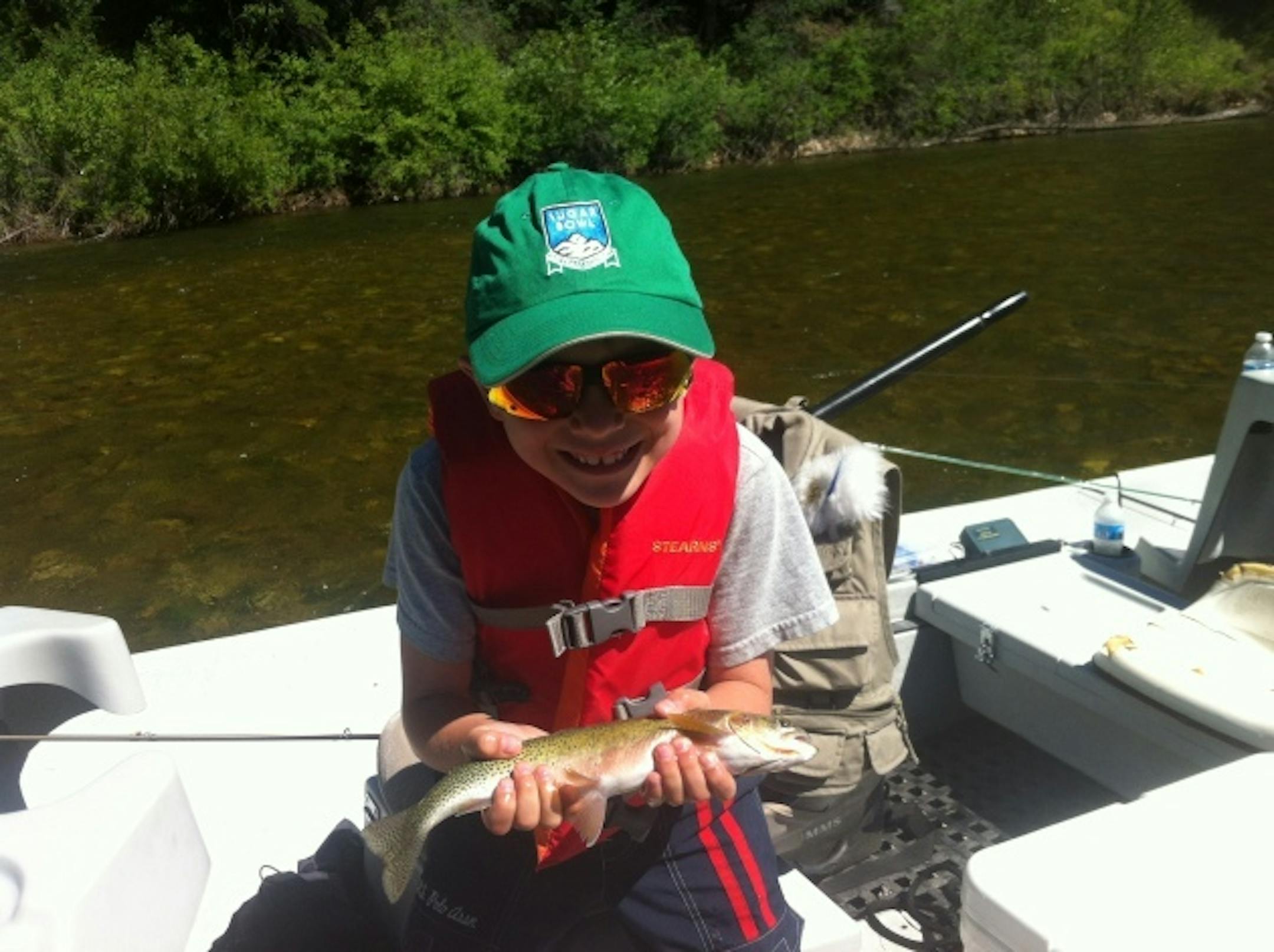 Charlie with his first trout on a fly