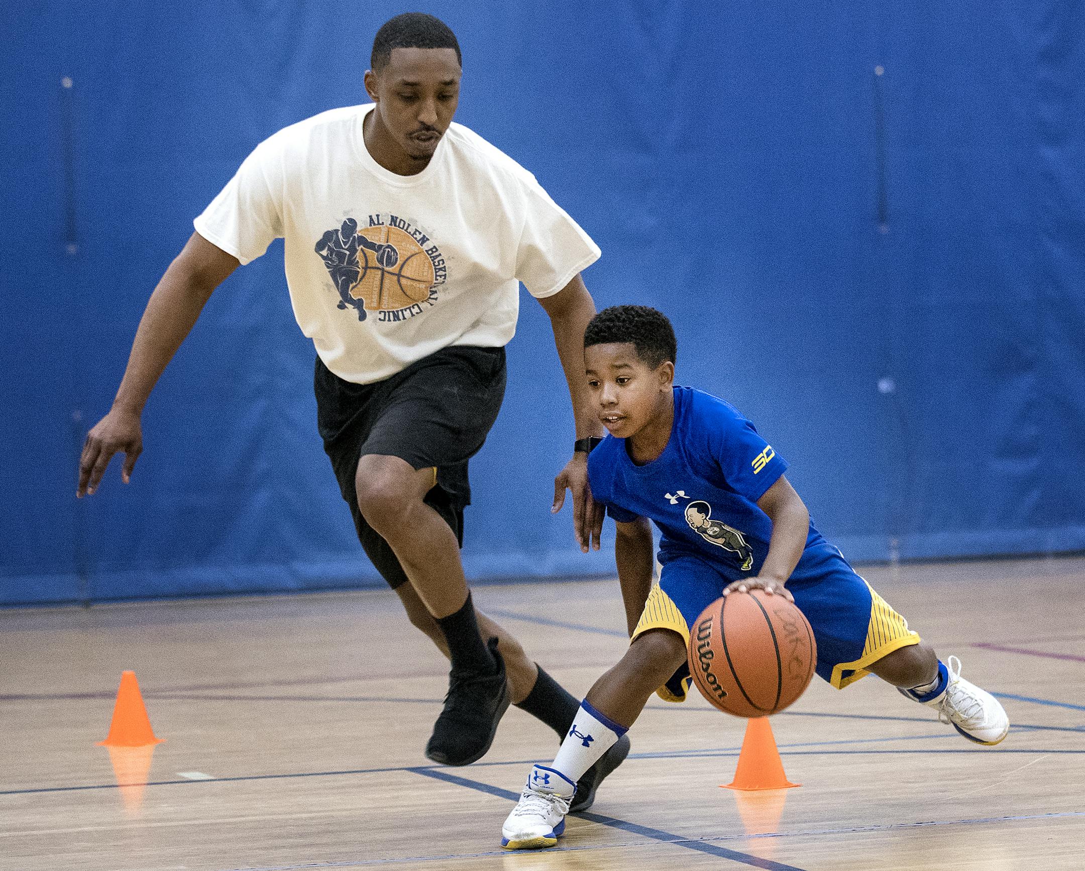 Kristian Baker, 10, trained during a private lesson with Al Nolen at the Davis Community Center. ] CARLOS GONZALEZ ï cgonzalez@startribune.com - April 30, 2017, Golden Valley, MN, The new trend in basketball circles is year-round training under private instructors. Former Gophers point guard Al Nolen embodies the trend.