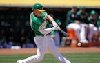Oakland Athletics' Matt Chapman connects for an RBI groundout off Chicago White Sox Reynaldo Lopez in the third inning of a baseball game Sunday, July