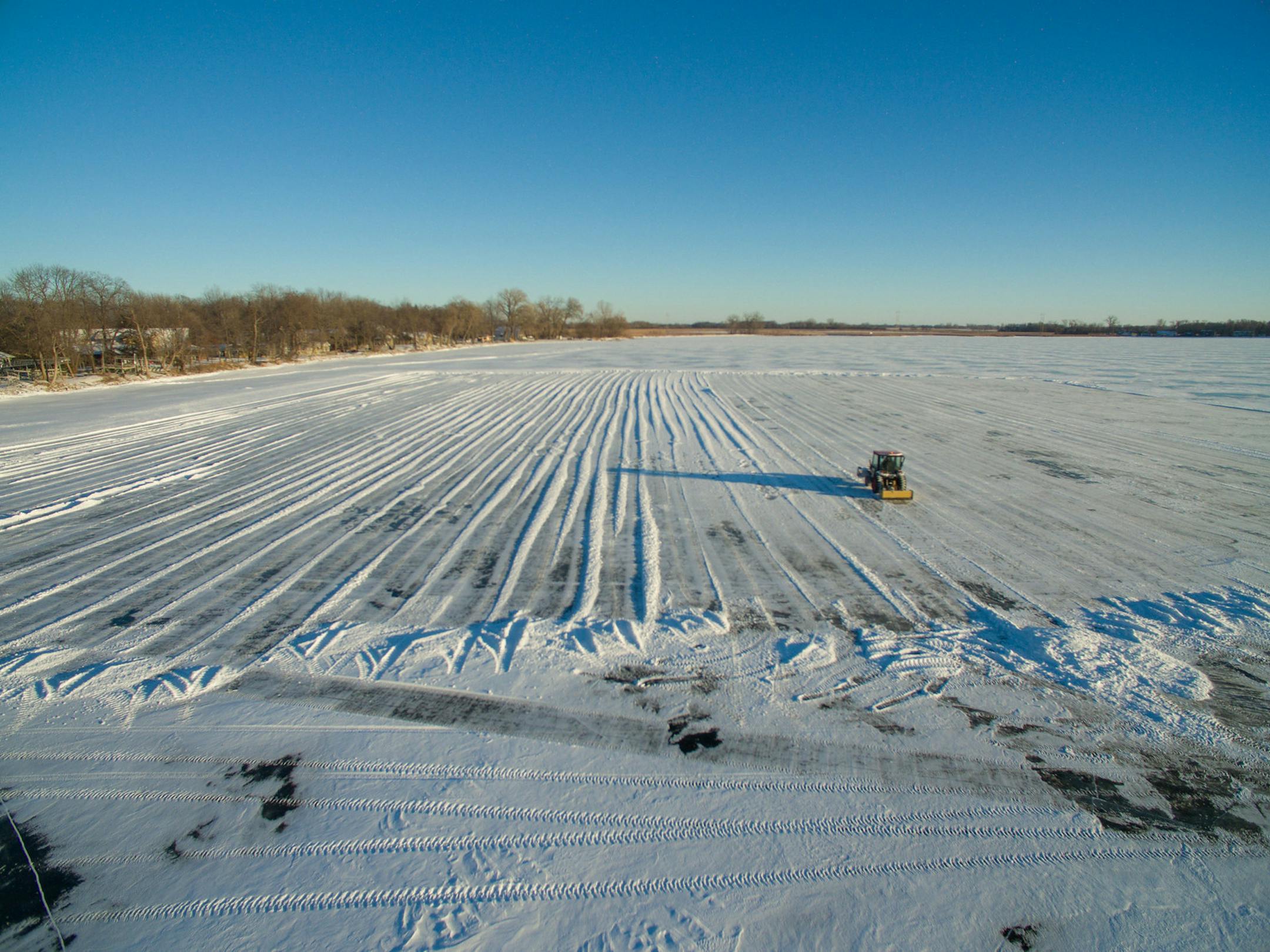 Part of Green Lake near Spicer, Minn., is prepped Monday, Jan. 1, 2018, for the harvesting of ice for the St. Paul Winter Carnival ice palace. Around 4,000 blocks of ice will be cut from the lake for construction of the palace which will be in Rice Park.