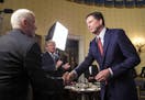 FILE -- FBI Director James Comey greets Vice President Mike Pence and President Donald Trump during a reception at the White House in Washington, Jan.