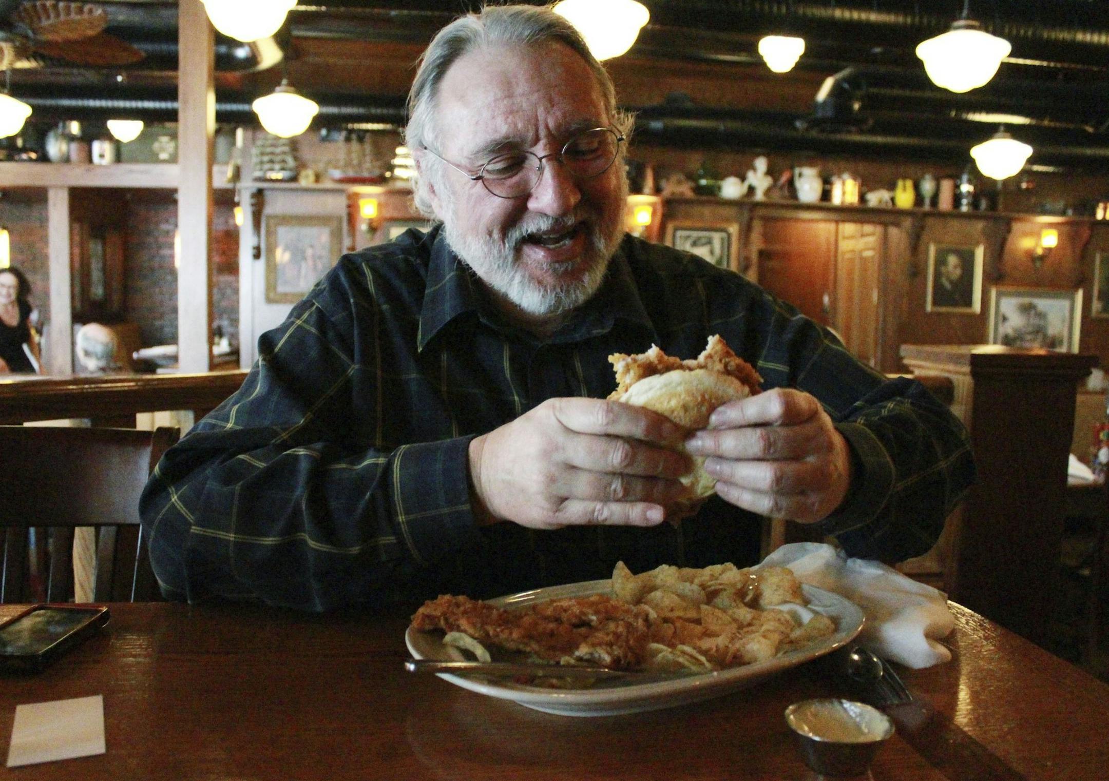 Rick Garrett is a breaded-tenderloin aficionado and a blogger who has reviewed more than 120 versions of the sandwich. Here, the breaded pork tenderloin sandwich is from The Aristocrat in Indianapolis. (Kevin Pang/Chicago Tribune/MCT) ORG XMIT: 1151482