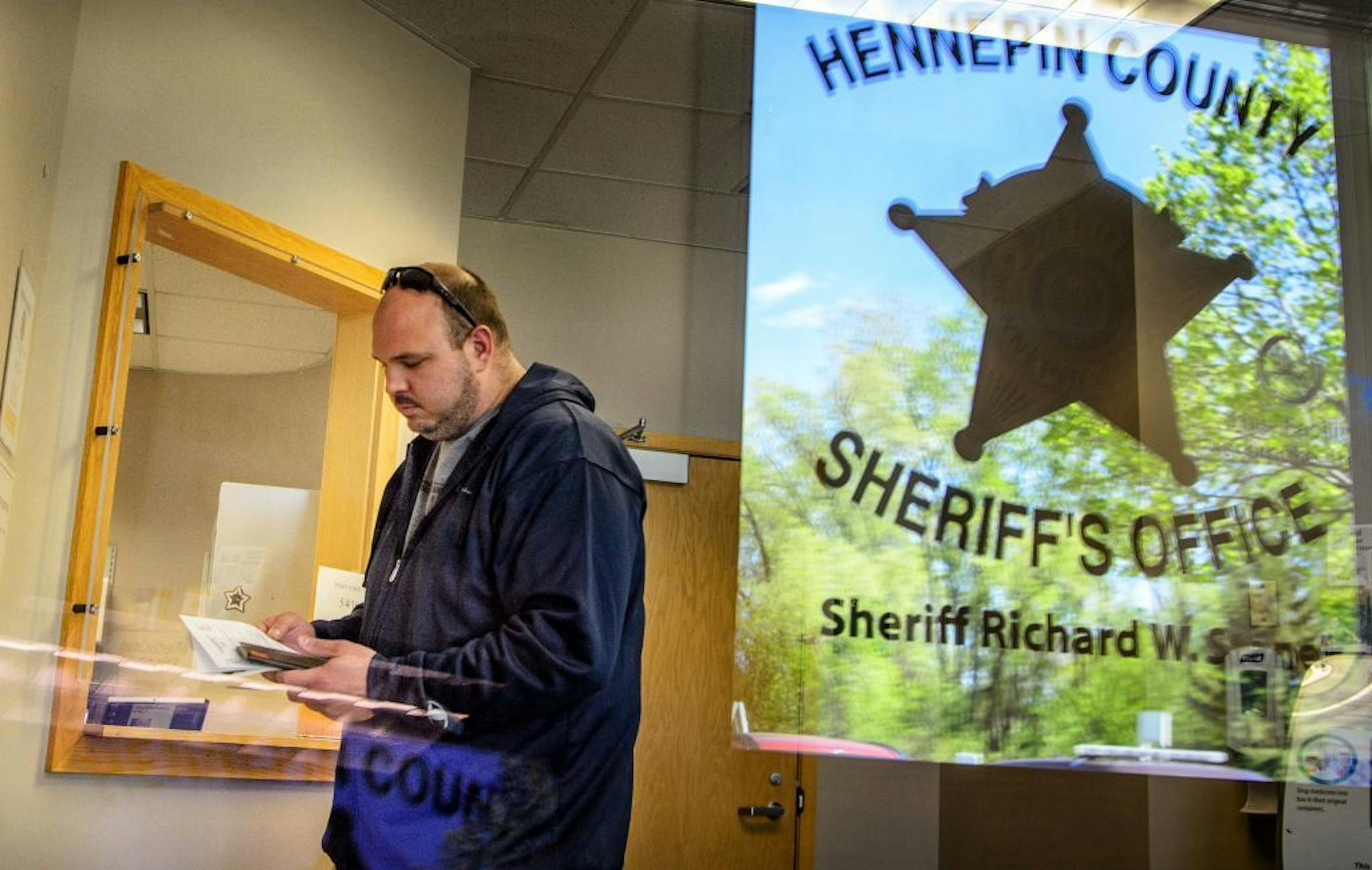 Matt Kowalski filled out forms at the new office.