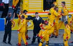 Joey Logano's crew members celebrated after the driver won the NASCAR Sprint Cup race at Talladega (Ala.) Superspeedway on Sunday.