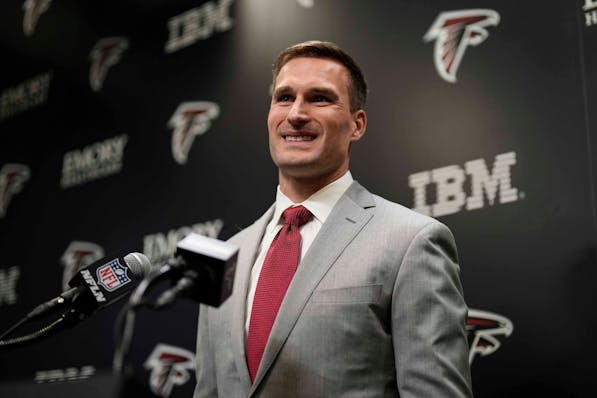 Atlanta Falcons quarterback Kirk Cousins speaks during a news conference in mid-March.