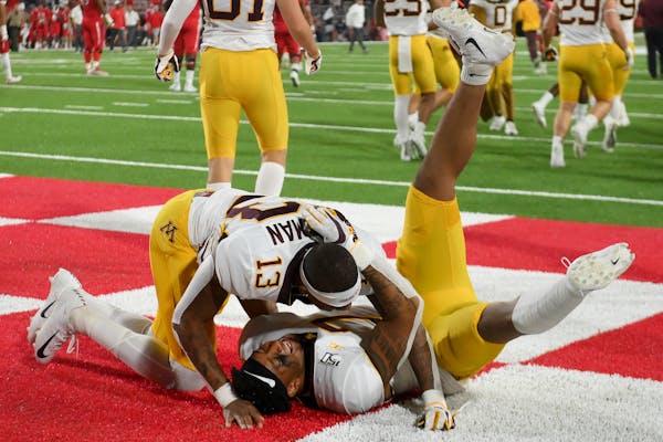 Gophers wide receiver Rashod Bateman (13) and wide receiver Chris Autman-Bell (7) celebrated after their overtime victory over Fresno State on Saturda