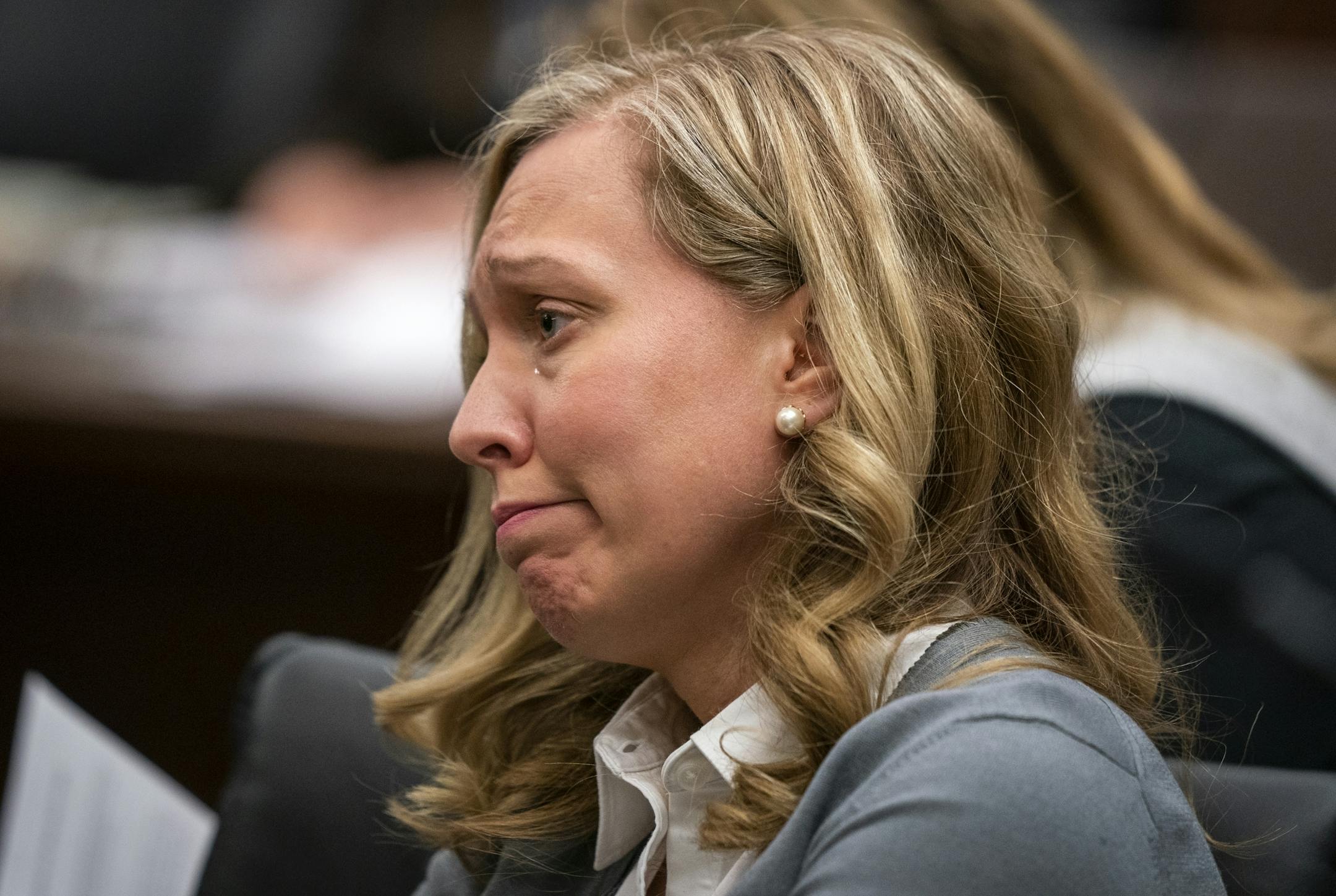 Rep. Heather Edelson (DFL-Edina) who is not on the committee but attended the hearing, gets emotional hearing the public testimony of some of her constituents.