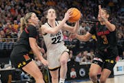 Iowa star Caitlin Clark (22) goes to the basket during last year's Big Ten tournament at Target Center.