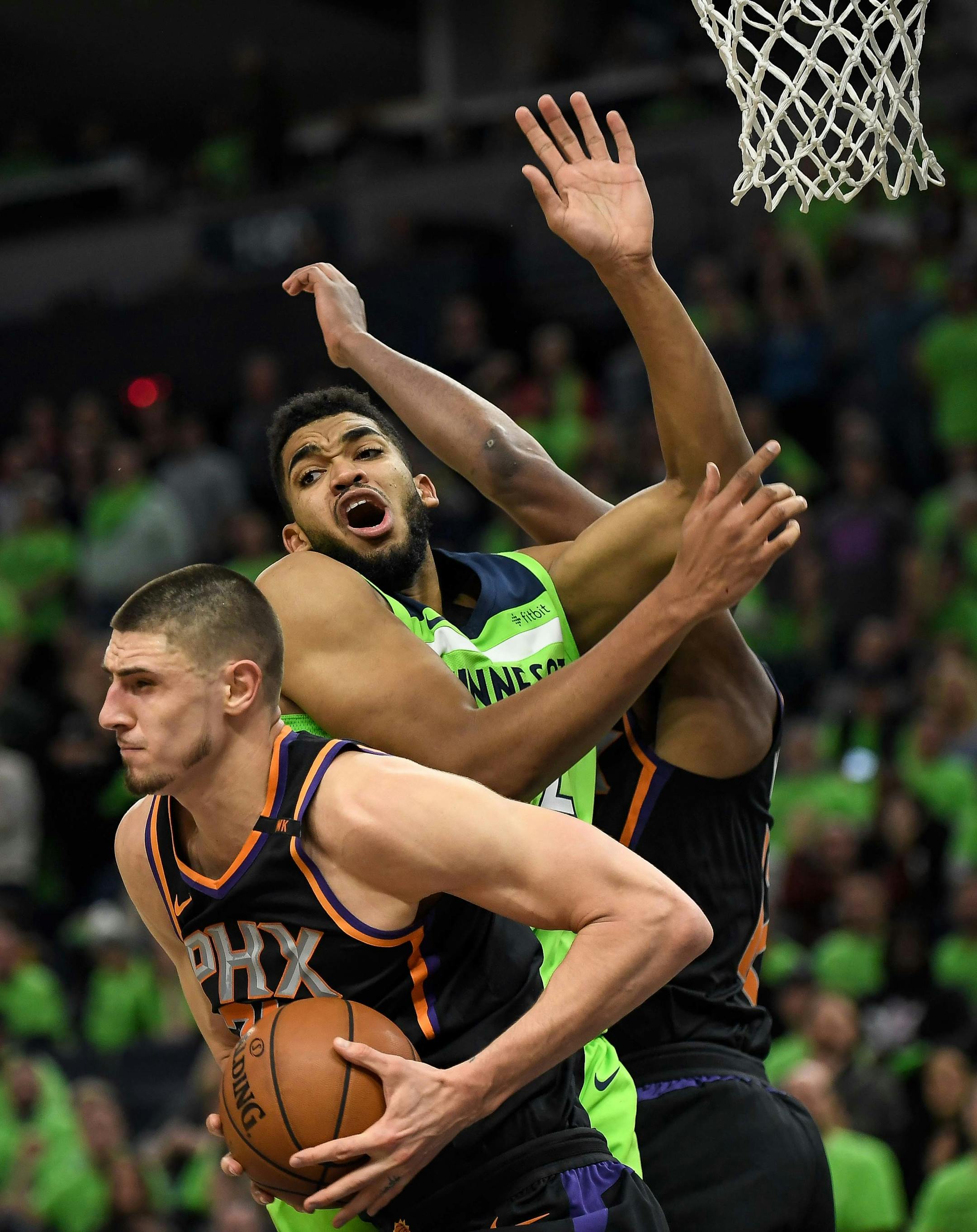 Phoenix Suns center Alex Len (21) pulled down a rebound off a missed shot by Minnesota Timberwolves center Karl-Anthony Towns (32) in the fourth quarter. ] AARON LAVINSKY ï aaron.lavinsky@startribune.com The Minnesota Timberwolves played the Phoenix Suns on Saturday, Dec. 16, 2017 at Target Center in Minneapolis, Minn.