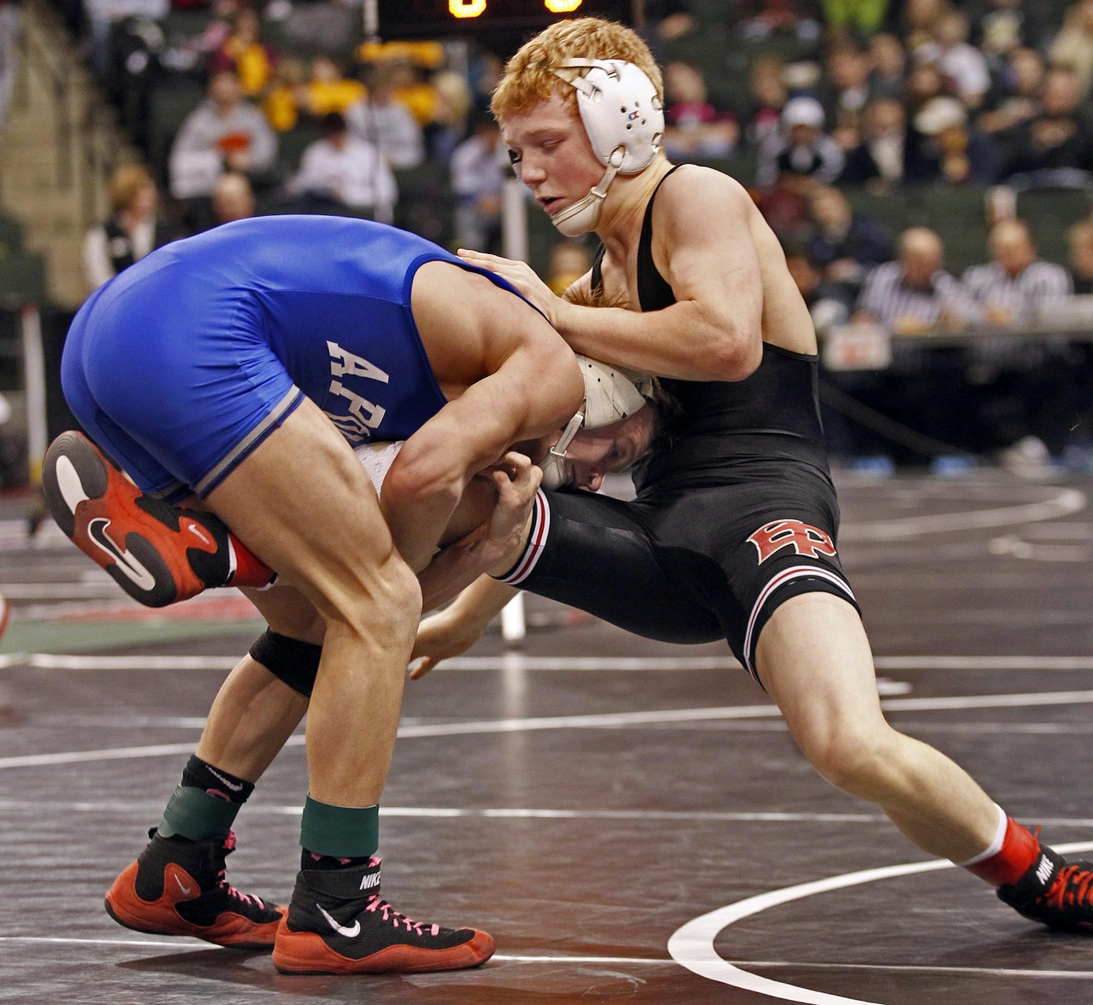 Mitch Bengtson of St. Cloud Apollo, left defeated Sam Brancale of Eden Prairie in the 119 lb class match.