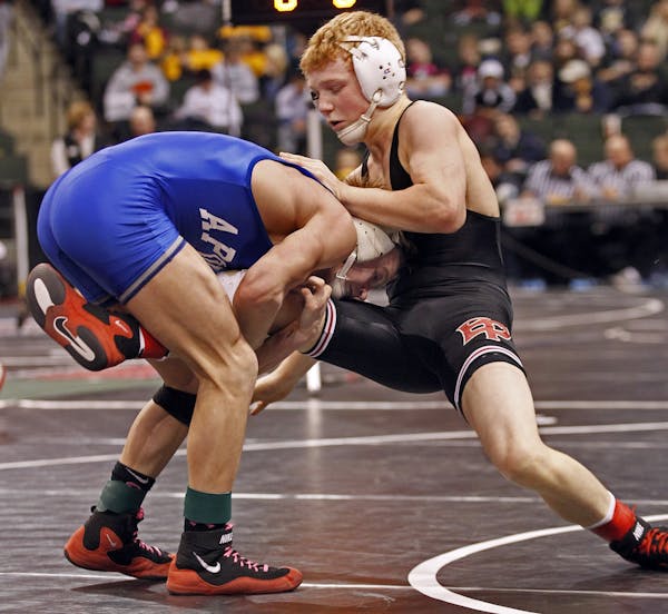 Mitch Bengtson of St. Cloud Apollo, left defeated Sam Brancale of Eden Prairie in the 119 lb class match.